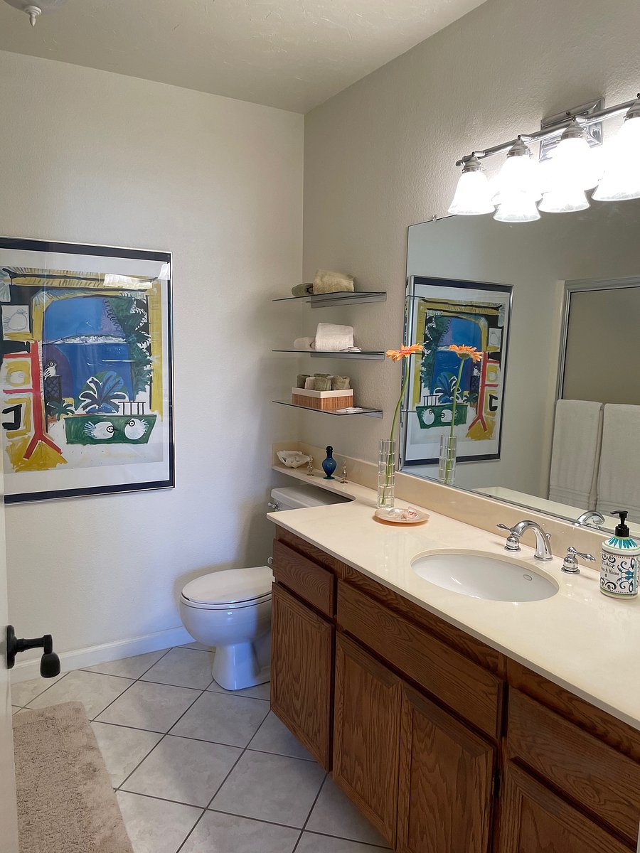 Ensuite full bath cabinets are now white.