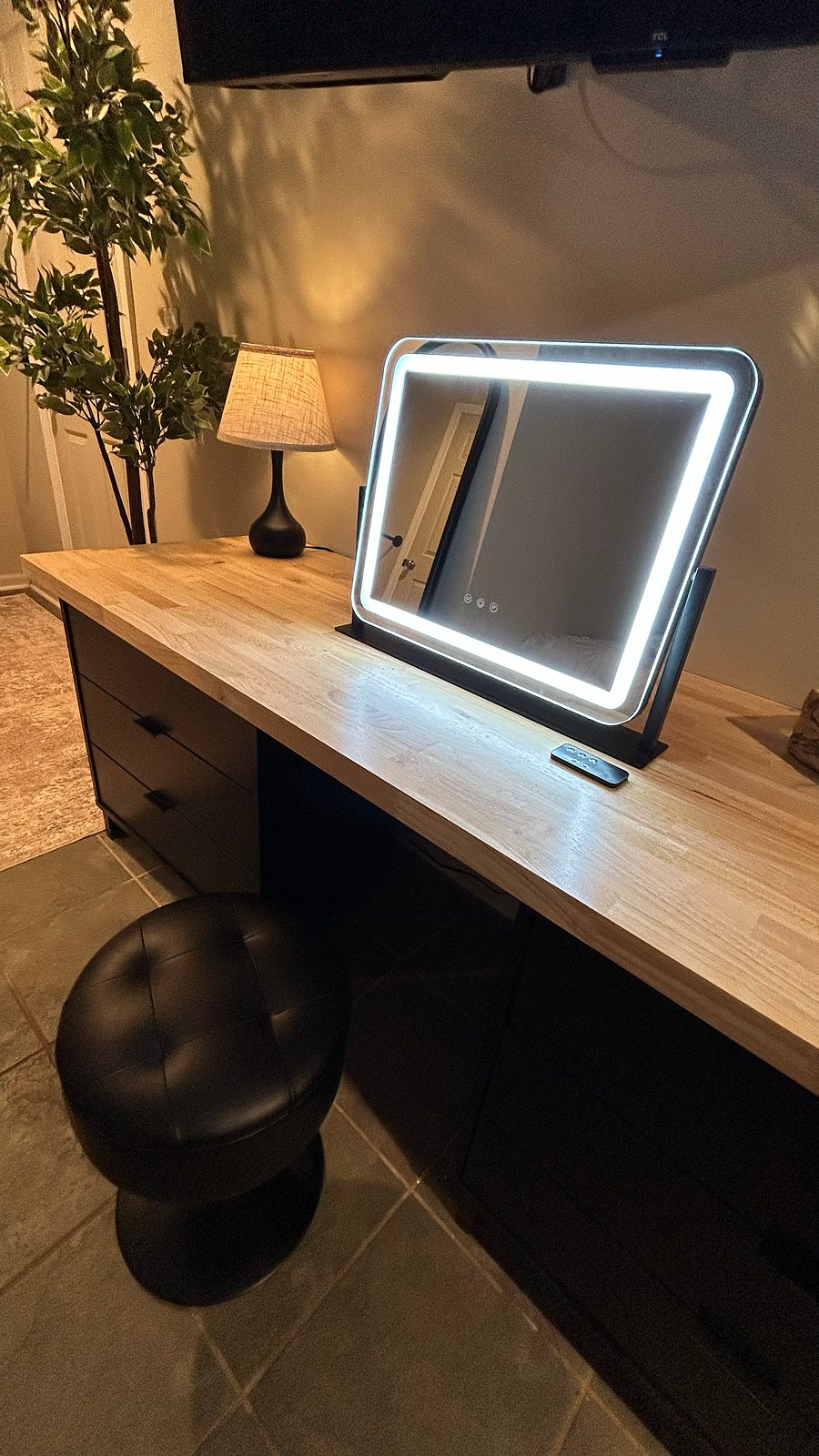 Multifunctional dresser/desk/vanity with 360 rotating lighted mirror. 