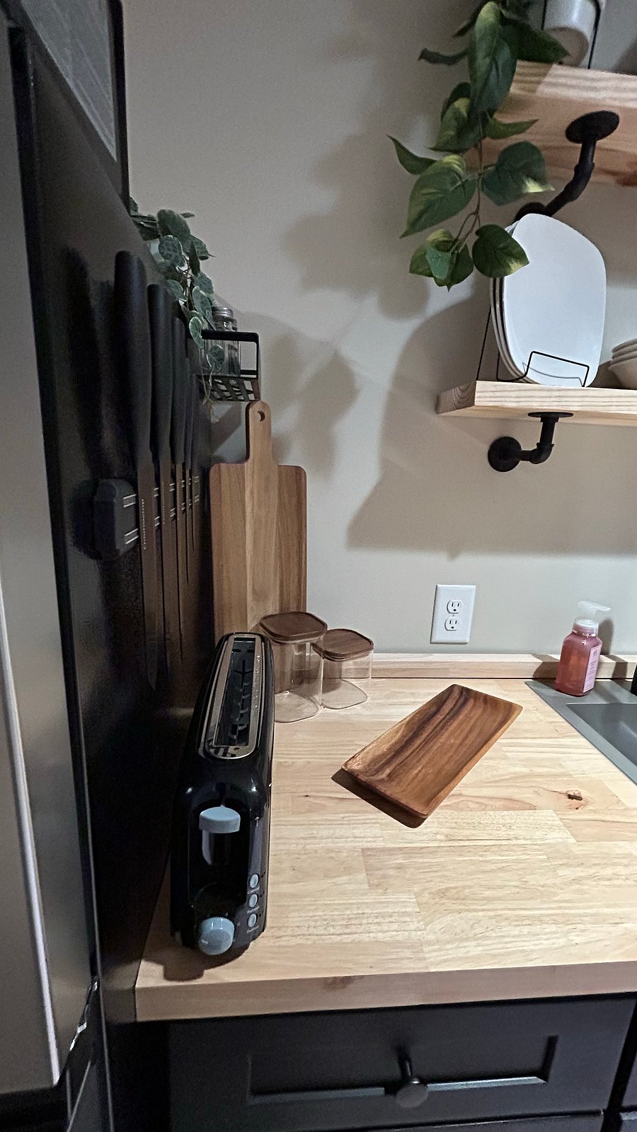 Fully functional kitchenette with Knifes, dishware,utensils, toaster, air fryer, sink, microwave and fulll size apartment fridge and double induction stove top that tucks away when not needed. 