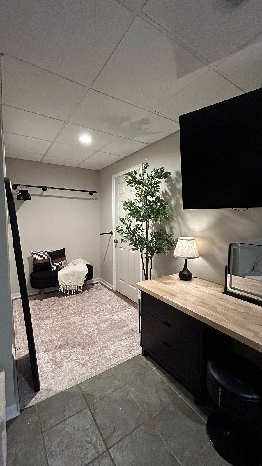Open concept closet/dressing area outside private bath. 