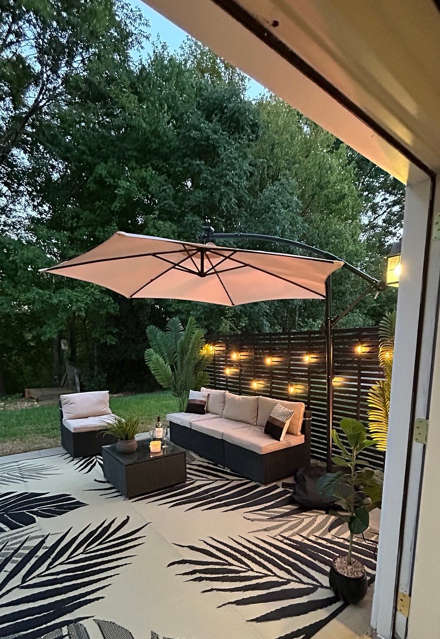 Private patio off the studio apartment from French doors that open onto the patio- veiw is a wooded area with creek 