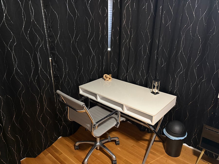Dedicated work area with comfortable office chair.