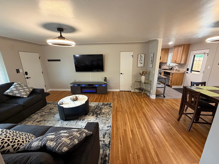 Recently refinished real wood floors add warmth to the space.