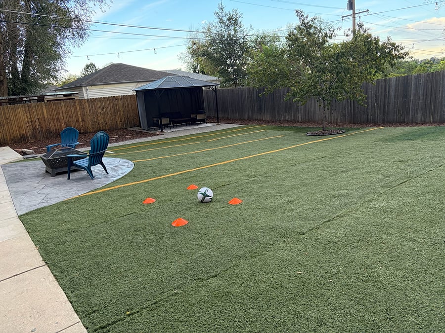Drought-friendly recycled athletic turf from a local soccer field provides a large area for games.