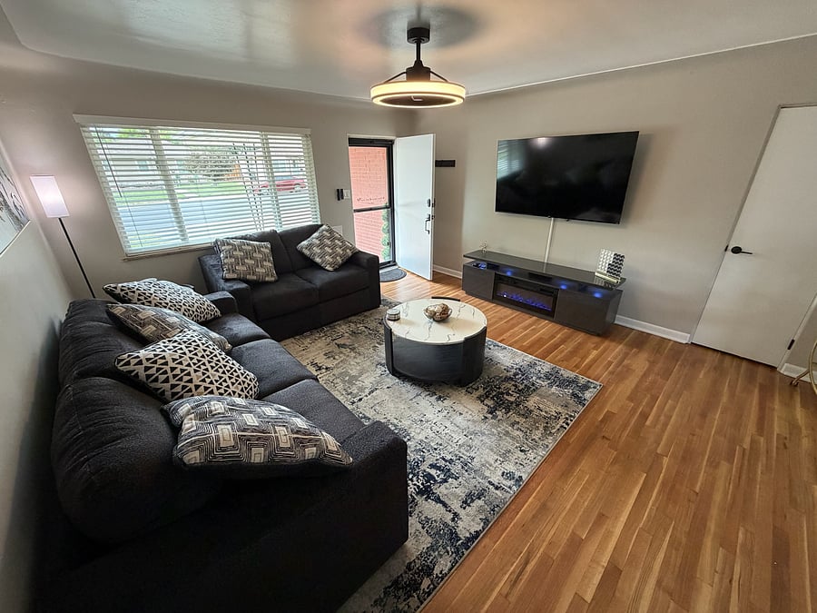 Spacious and open living room with 65" smart TV to connect to all of your streaming services.