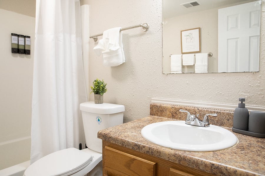 A clean and well-appointed full bathroom with everything you need to freshen up ad get ready for the day.