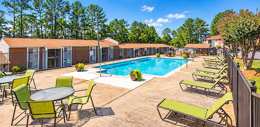 Enjoy sunny days by the pool, unwind on the lounge chairs, and soak up the sunshine in the relaxing outdoor space.