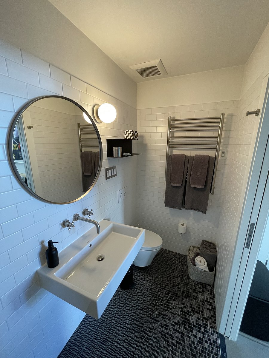 Heated rack dries towels quickly and warms them for your next shower. Sliding pocket door with opaque glass for privacy.