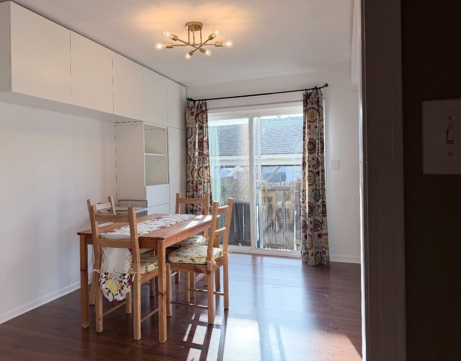 Dining room with extra wall storage for pantry essentials.