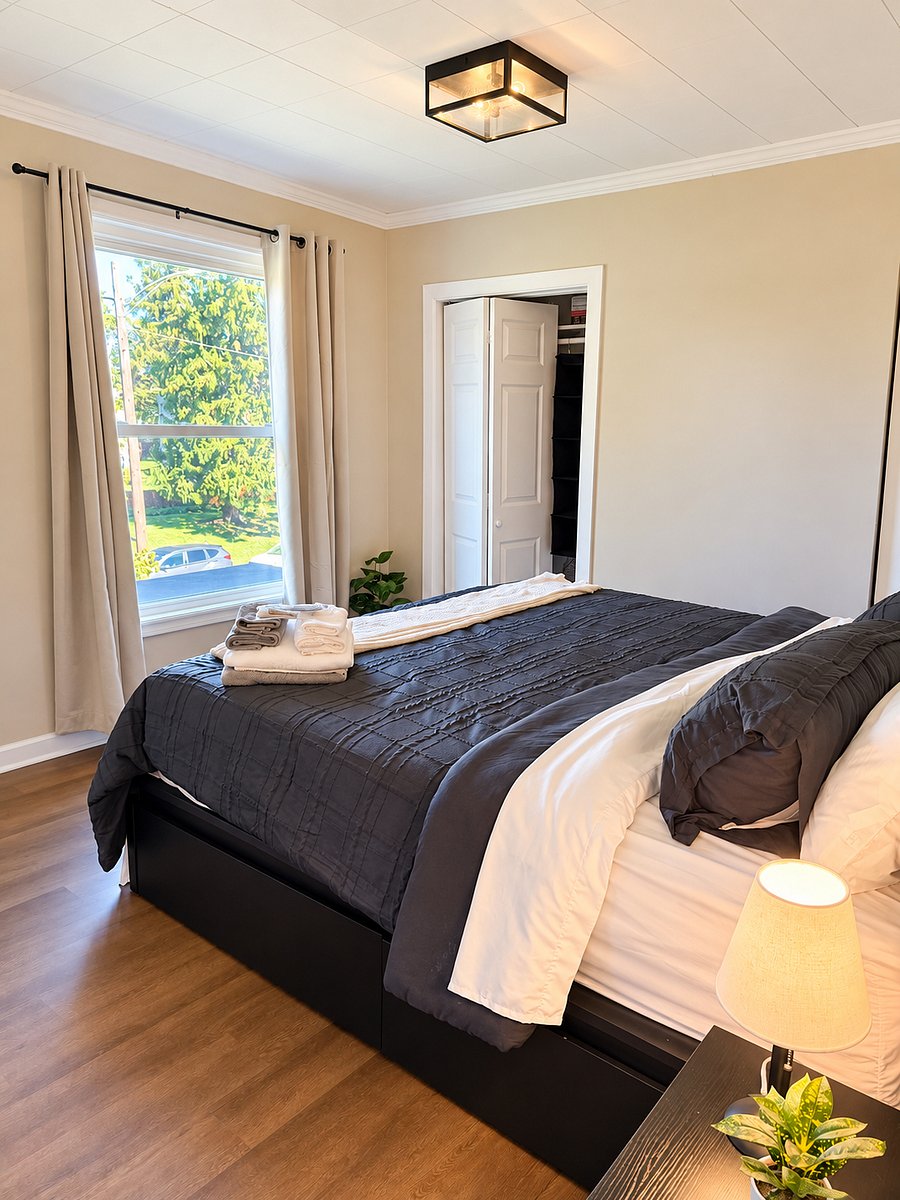 Master Bedroom - Spacious Closets, Wide Window with Room Darkening Curtains