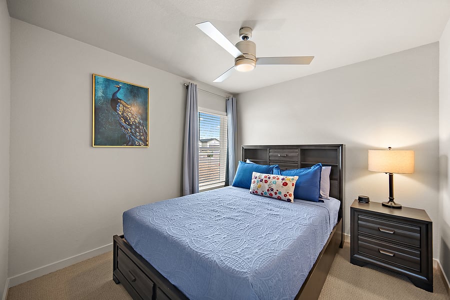 Comfortable furnishings, fresh linens, and a ceiling fan for restful nights.