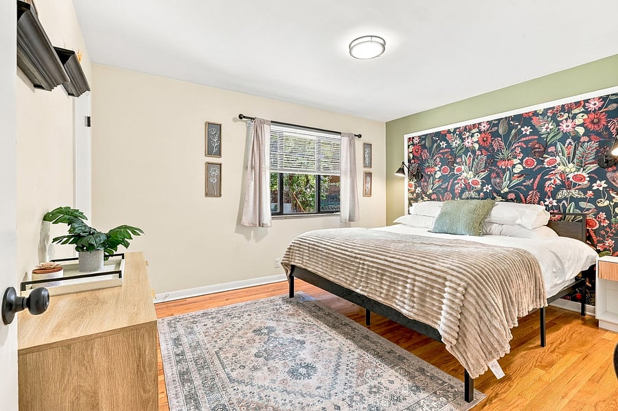 King-size bed with two closets and a raised frame for storing suitcases