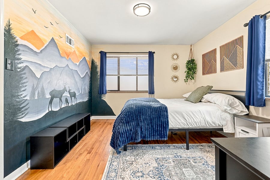 Queen-size bed with a spacious closet and a raised frame for extra storage underneath.