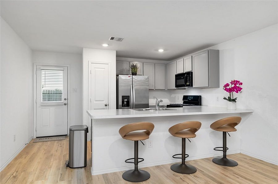 Additional seating at the breakfast bar area.