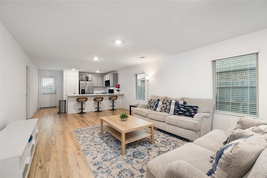Open concept floor plan. Living/family room open to kitchen and flex room. 