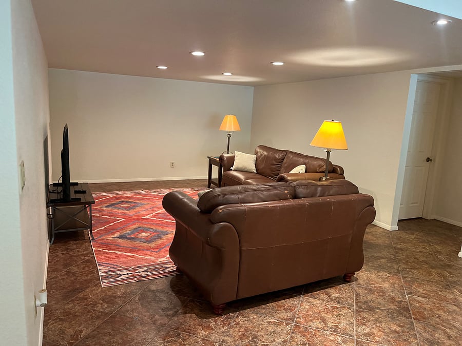 Large family room with space for exercise mat and desk for work area