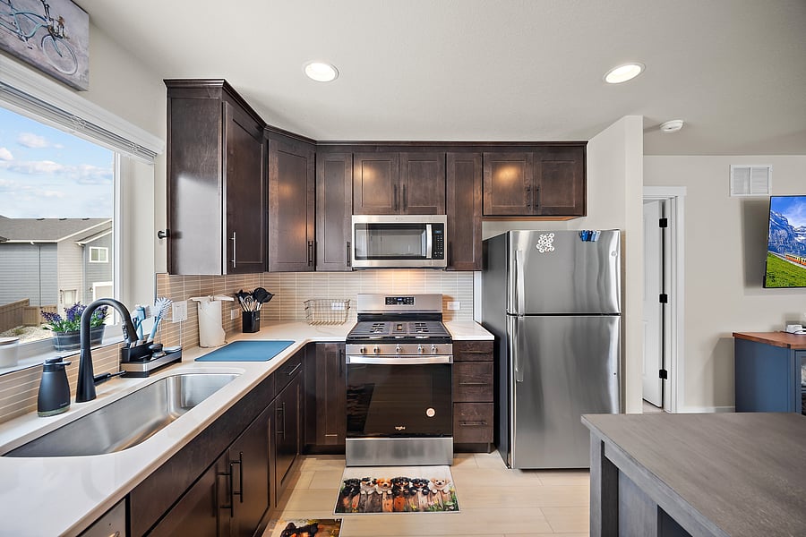 Cook at home with a full kitchen and stainless steel appliances.