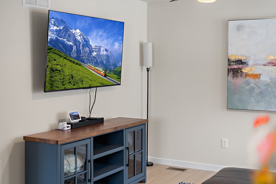 Movie night, upgraded: 65" Smart TV with soundbar.
