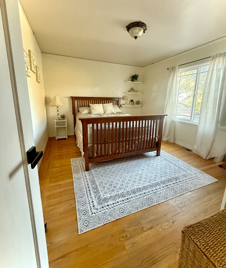 1st bedroom with queen bed and relaxing atmosphere