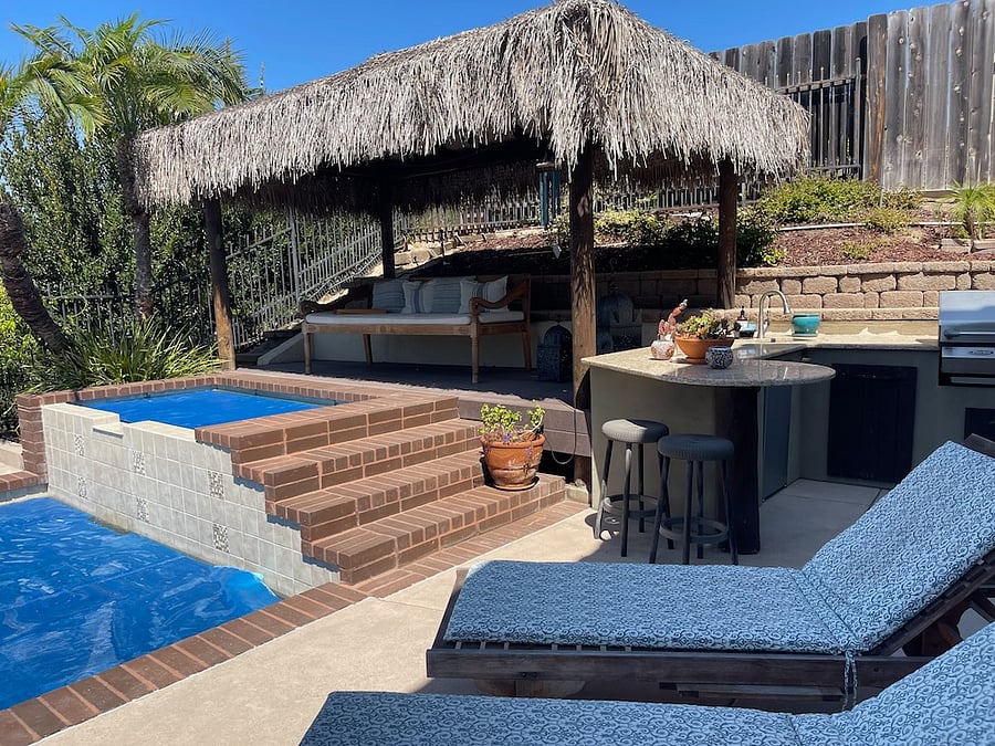 Jacuzzi, covered patio and outdoor kitchen area