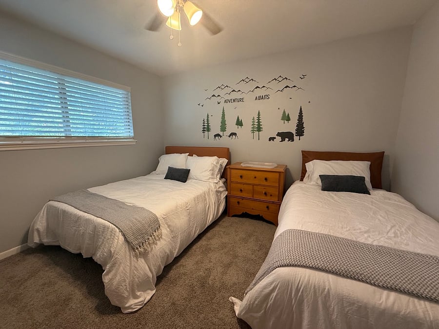 Shared bedroom with full sized bed and twin bed