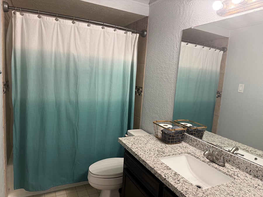 Upstairs bathroom accessible by hall