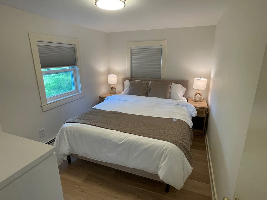 Primary bedroom with blackout shades and all new furniture and bedding