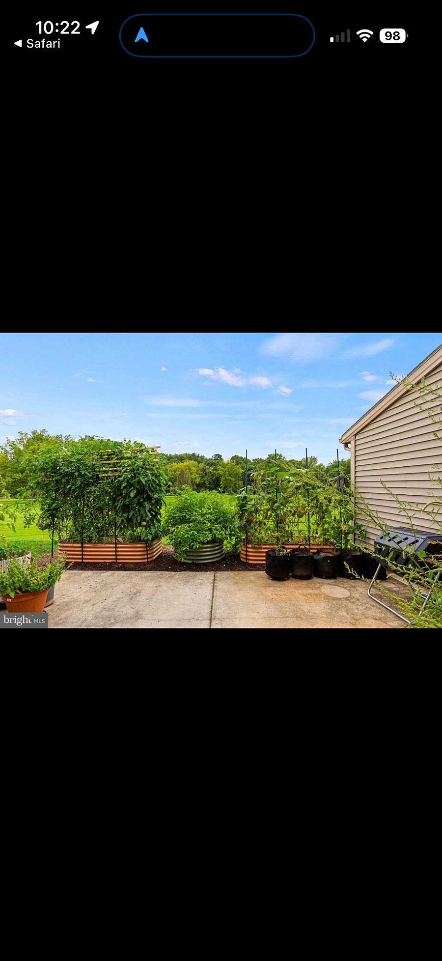 Back patio opens to large green space with walking trails