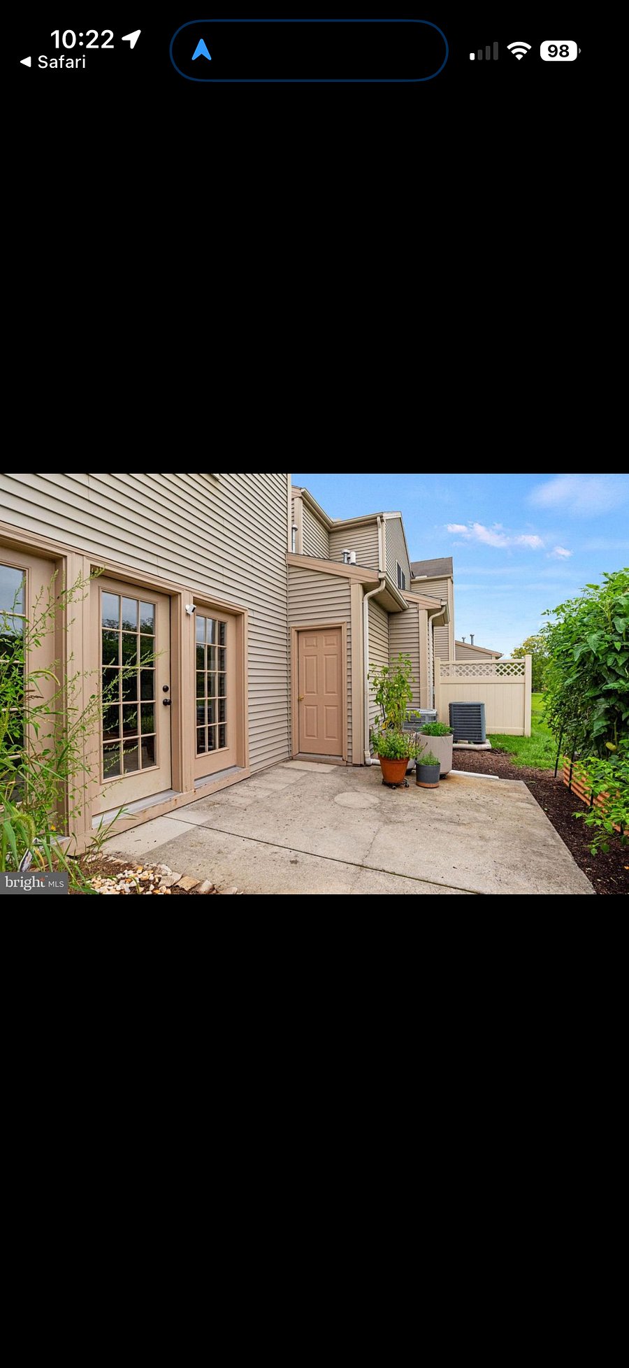 Back patio opens to large green space