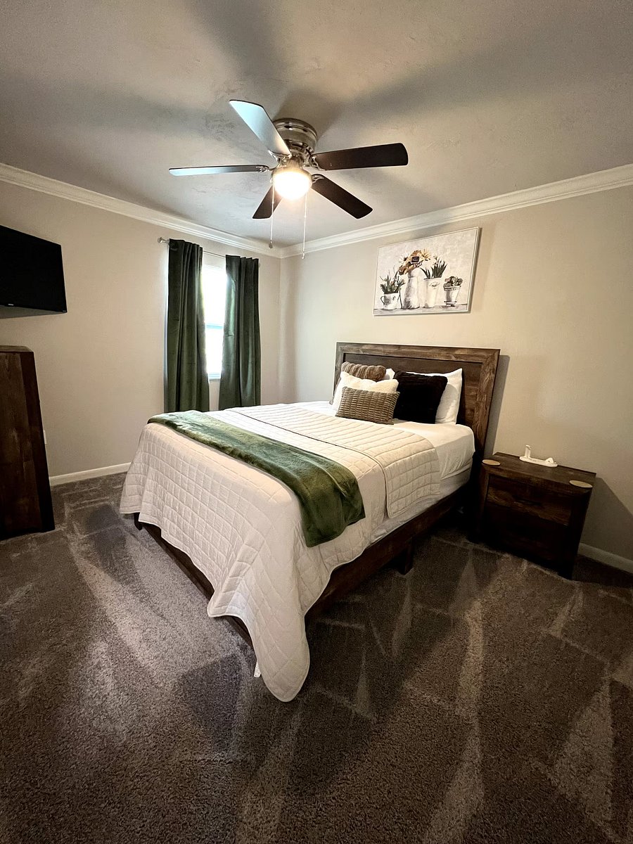 Bedroom 1: Queen sized bed, 42-inch Smart Roku TV, brown furniture. Room decor for display only. Will be able to decorate room as you please.