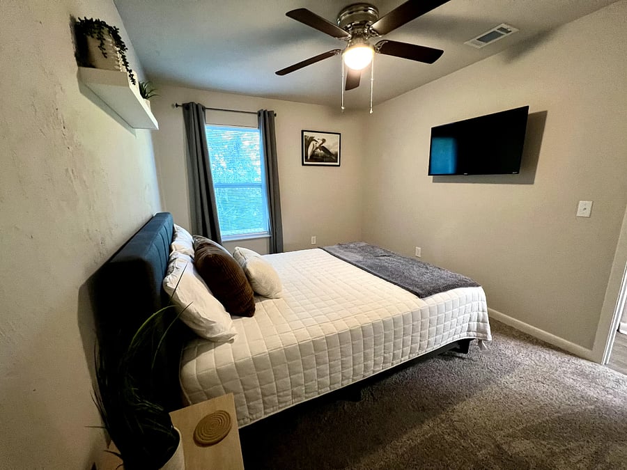 Bedroom 2: Queen sized bed, 42-inch Smart Roku TV, gray furniture. Will also have dresser. Room decor for display only. Will be able to decorate room as you please.