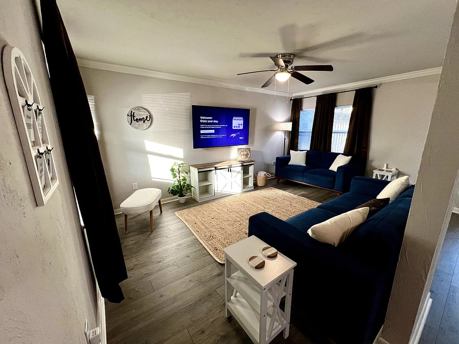 Cozy living room w/ wall mounted 60 inch smart tv
