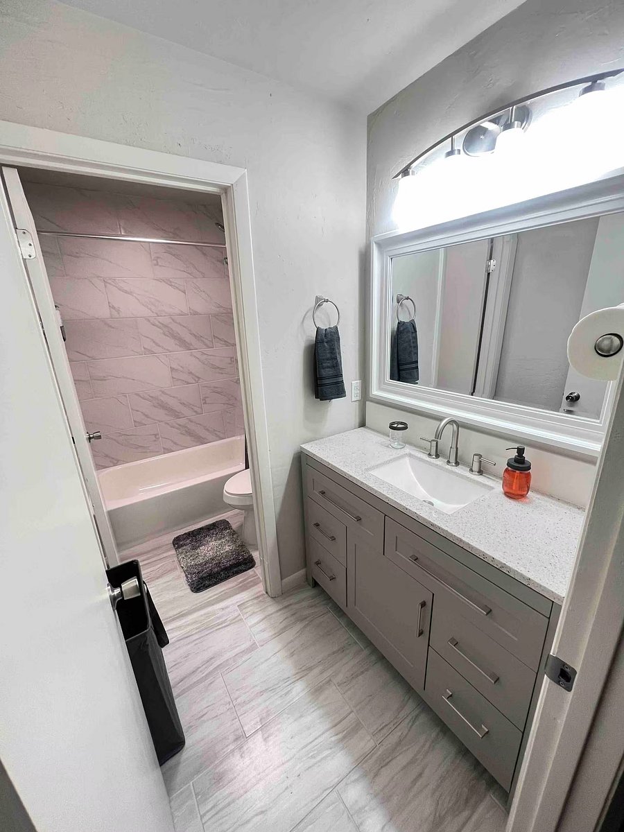 Upstairs split full sized bath, perfect for two tenants. Door separates vanity and shower/ toilet area. Vanity w/ perfect drawer to split for two tenants! 