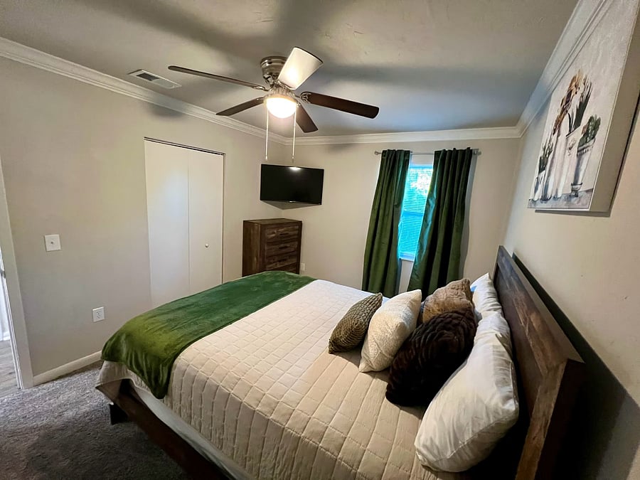Bedroom 1: Queen sized bed, 42-inch Smart Roku TV, brown furniture. Room decor for display only. Will be able to decorate room as you please.
