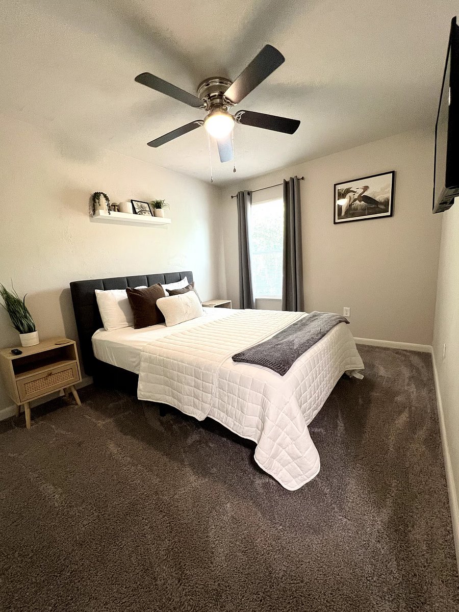Bedroom 2: Queen sized bed, 42-inch Smart Roku TV, gray furniture. Will also have dresser. Room decor for display only. Will be able to decorate room as you please.