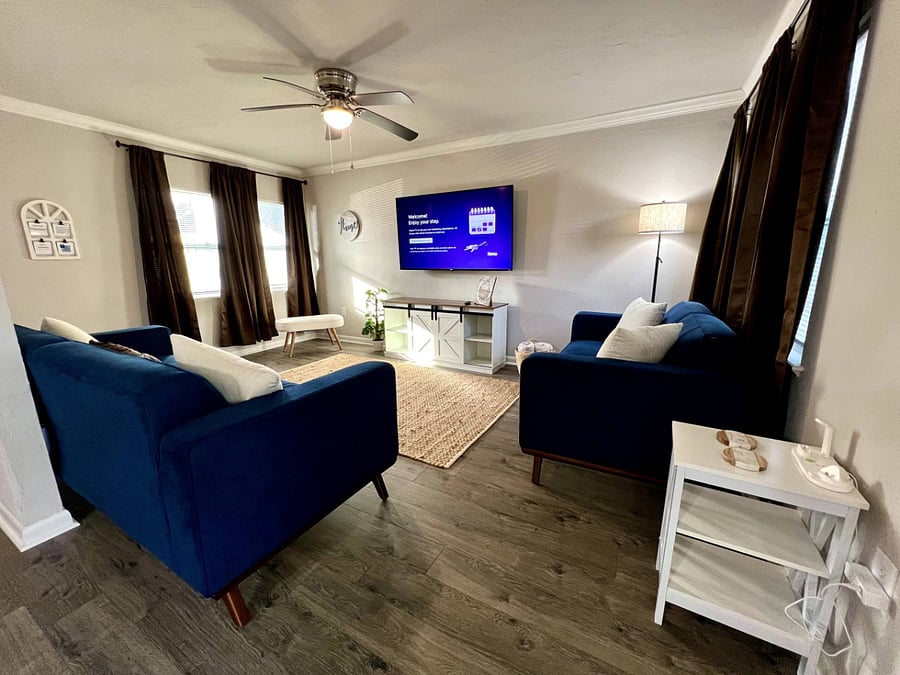 Cozy living room w/ wall mounted 60 inch smart tv!