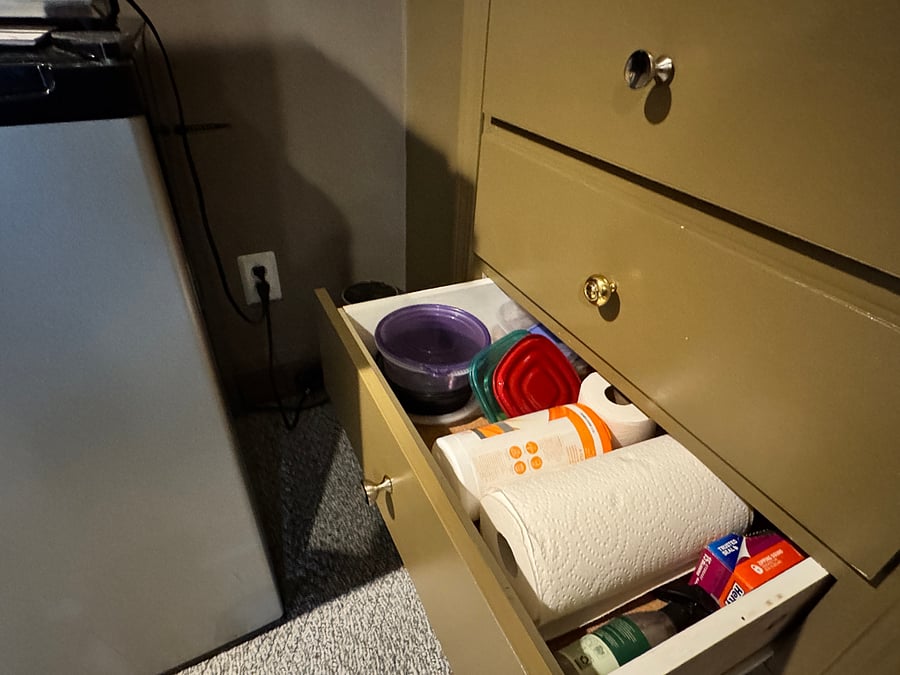 Built-in drawers (cleaning supplies and food containers)