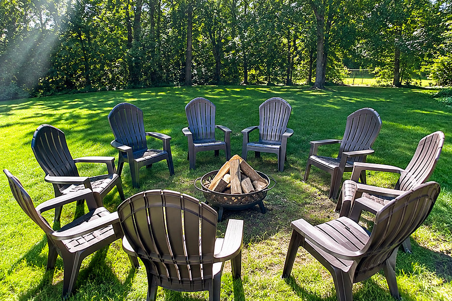 Enjoy the fenced backyard's fire pit.