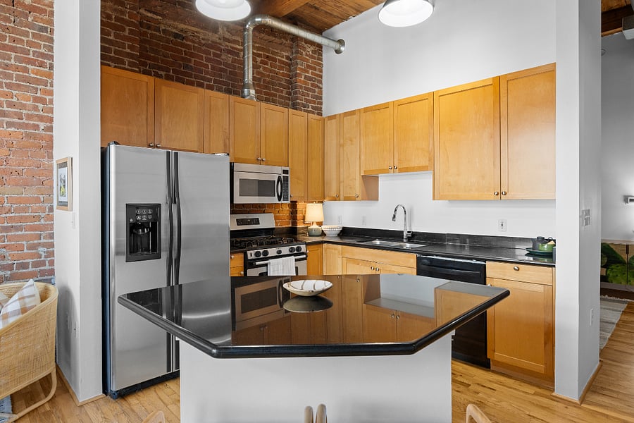 Full kitchen with all the necessary appliances, essentials, and space! The island has storage and countertop seating.