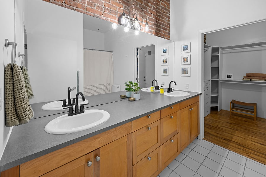 Double sinks, storage underneath, large closet