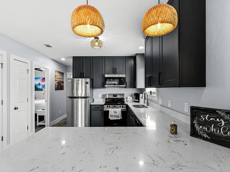 Fully equipped kitchen with full-size appliances, ample storage and counter space