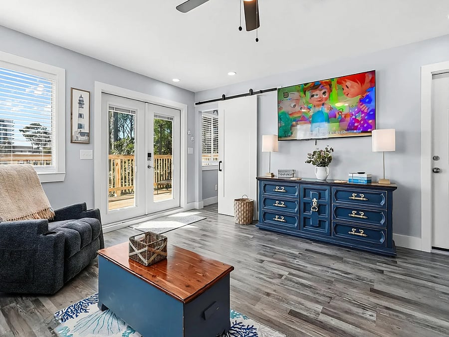 Bright and spacious living area with Smart TV and private balcony access
