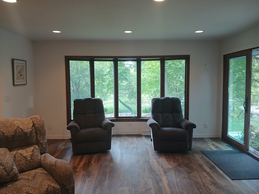 Family room looking out to back yard and river. Chairs rock, swivel and recline.