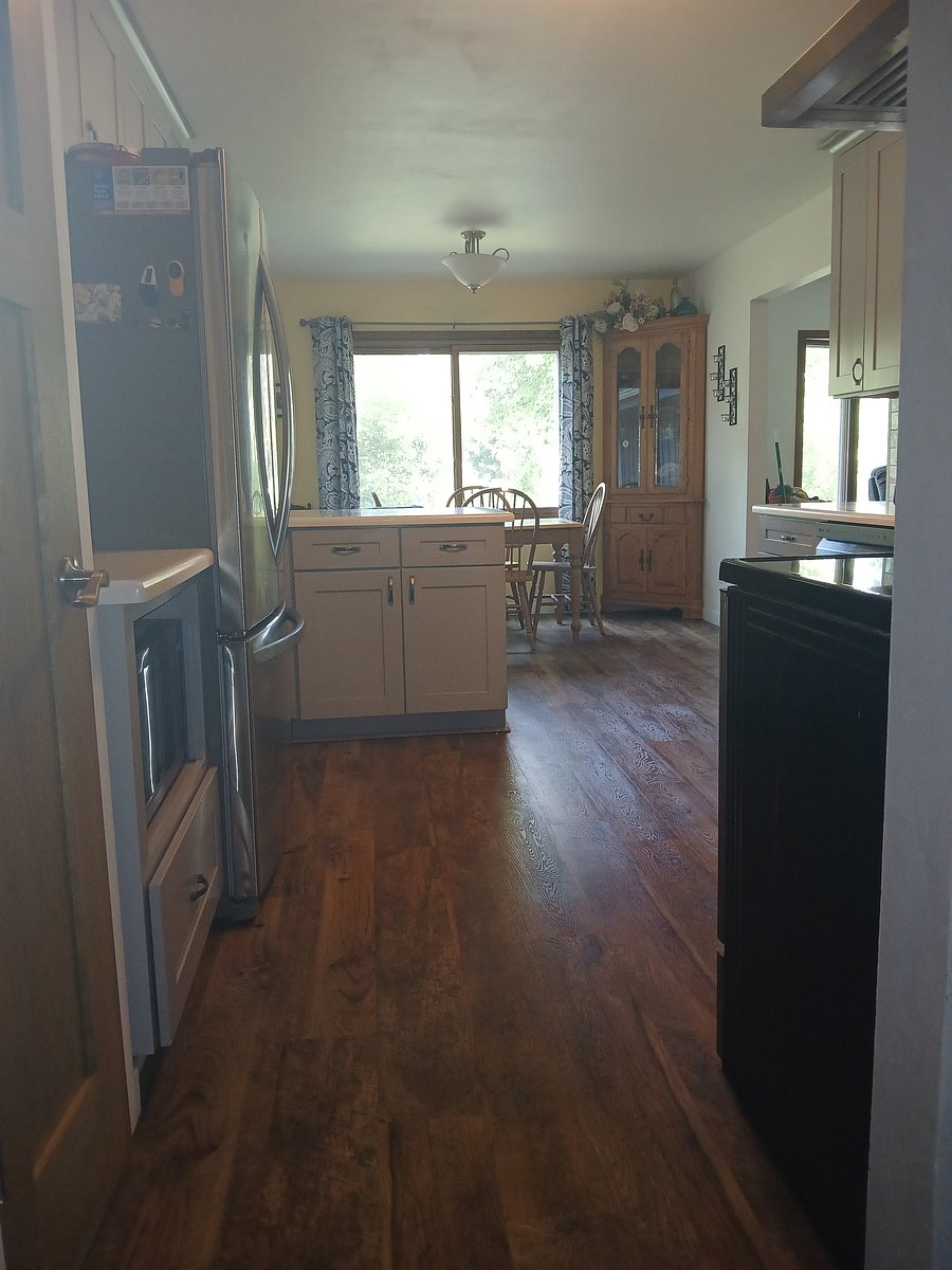 Kitchen looking toward dining area from laundry room