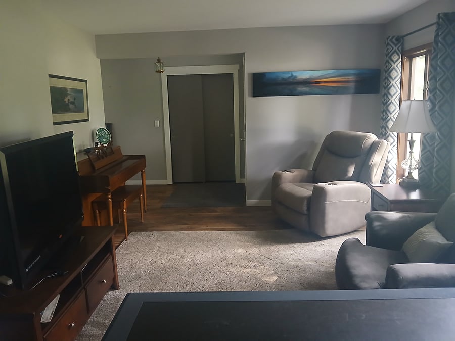Living room looking at entrance.