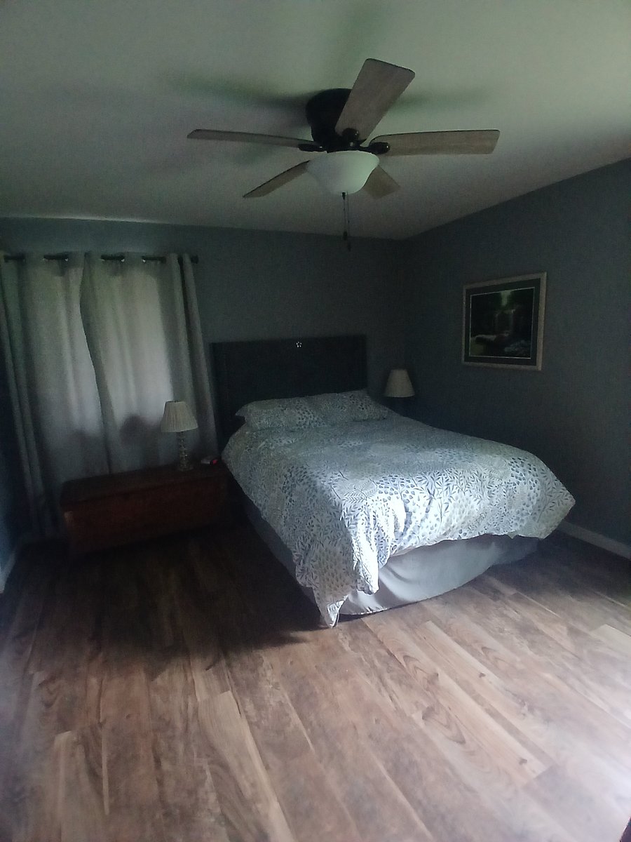 Master bedroom with queen size bed.