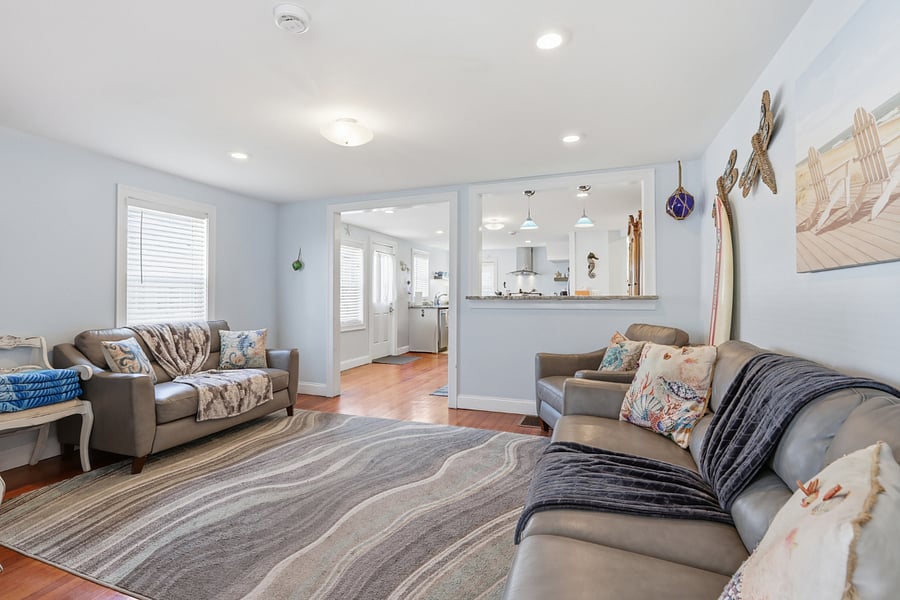Living room with sofa, loveseat, chair, and tv