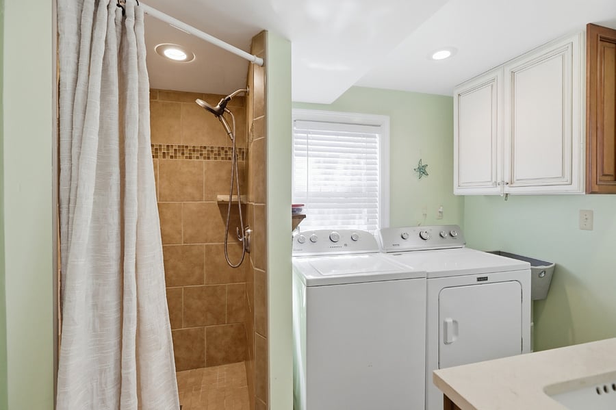 Full bathroom with washer and dryer on 1st floor
