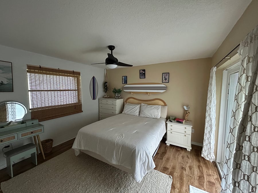 Bedroom 2 with sliding door access to the lanai/pool area