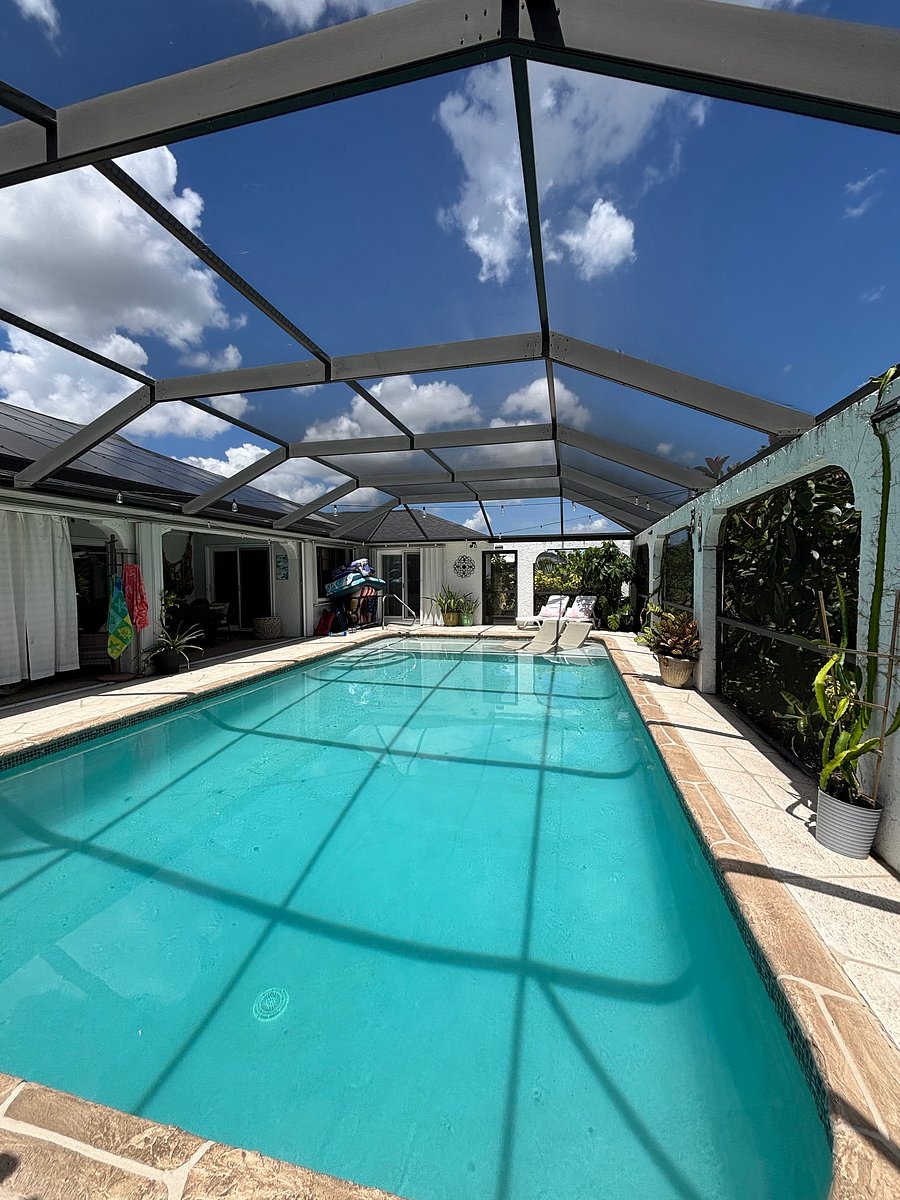 Large pool with sun-shelf and resort style chairs